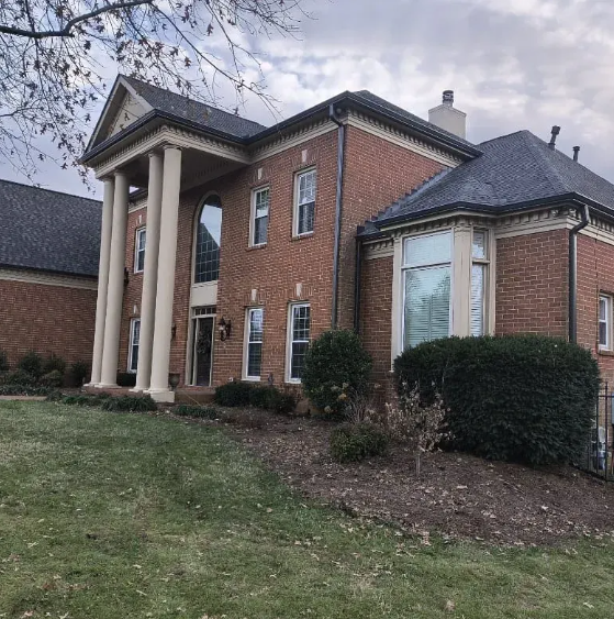 Colonial brick home gutter installation Franklin TN